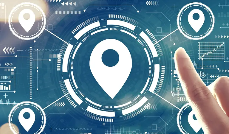 Hand pointing at digital interface with multiple white location pin icons on blue background.